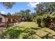 Spacious backyard with lush lawn and a wooden deck perfect for outdoor relaxation at 8239 26Th N Ave, St Petersburg, FL 33710