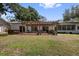 Large backyard with covered patio offering a great space for outdoor activities at 8239 26Th N Ave, St Petersburg, FL 33710