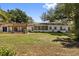 Spacious backyard with a pergola and plenty of room for outdoor activities and entertaining at 8239 26Th N Ave, St Petersburg, FL 33710