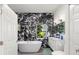 Modern bathroom featuring a freestanding tub, marble accent wall, and vanity at 8239 26Th N Ave, St Petersburg, FL 33710