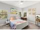 Bright bedroom with a ceiling fan and three windows at 8239 26Th N Ave, St Petersburg, FL 33710