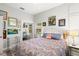 Bright bedroom featuring patterned bedding and colorful artwork on the walls at 8239 26Th N Ave, St Petersburg, FL 33710