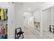 Hallway with organized closet shelving and sliding doors at 8239 26Th N Ave, St Petersburg, FL 33710