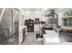 Open-concept kitchen with stainless steel appliances, tile backsplash, and plenty of counter space at 8239 26Th N Ave, St Petersburg, FL 33710