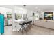 Kitchen island with modern bar stools and a view into the bright, open kitchen at 8239 26Th N Ave, St Petersburg, FL 33710