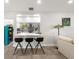 Kitchen island featuring modern stools and a view into the well-appointed kitchen at 8239 26Th N Ave, St Petersburg, FL 33710