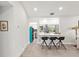 Kitchen island with bar seating and a view into the modern kitchen at 8239 26Th N Ave, St Petersburg, FL 33710