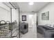 Functional laundry room with modern washer and dryer, plus ample shelving at 8239 26Th N Ave, St Petersburg, FL 33710