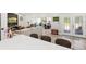 Open-concept living room boasts tile floors, comfortable seating, and an abundance of natural light at 8239 26Th N Ave, St Petersburg, FL 33710