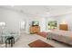 Bright main bedroom featuring tile floors, a large window, and comfortable furnishings at 8239 26Th N Ave, St Petersburg, FL 33710
