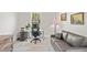 Home office featuring a modern desk, chair, and a comfortable couch at 8239 26Th N Ave, St Petersburg, FL 33710