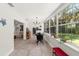 Charming sunroom filled with natural light featuring tile floors and access to the backyard at 8239 26Th N Ave, St Petersburg, FL 33710