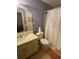 Standard bathroom featuring a vanity, toilet, and shower with curtain at 9481 Highland Oak Dr # 1202, Tampa, FL 33647
