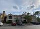 A charming multi-story condo building with well-maintained landscaping and convenient parking at 9481 Highland Oak Dr # 1202, Tampa, FL 33647