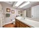 A well-lit bathroom with a shower and bath combination and earth-toned tile flooring at 980 Live Oak Ne Ave, St Petersburg, FL 33703