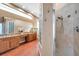 The primary bath includes a shower, a bath tub, double sinks and granite countertops, plenty of storage space at 980 Live Oak Ne Ave, St Petersburg, FL 33703