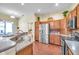Bright kitchen featuring stainless steel appliances, ample counter space, and wooden cabinets at 980 Live Oak Ne Ave, St Petersburg, FL 33703