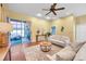 Bright living room features neutral decor, sliding glass doors, and stylish furnishings that offer relaxation at 980 Live Oak Ne Ave, St Petersburg, FL 33703