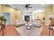 Spacious and bright living room with neutral tones and abundant natural light offers a welcoming atmosphere for Gathering and guests at 980 Live Oak Ne Ave, St Petersburg, FL 33703
