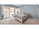 Serene main bedroom with sliding glass door access to the pool area at 980 Live Oak Ne Ave, St Petersburg, FL 33703
