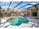 The screened-in pool and spa offer a luxurious outdoor experience with plenty of room to relax and enjoy the sunshine at 980 Live Oak Ne Ave, St Petersburg, FL 33703