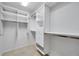 Spacious walk-in closet featuring built-in shelving, drawers, and ample hanging space at 980 Live Oak Ne Ave, St Petersburg, FL 33703