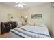 Inviting bedroom featuring a cozy bed, book shelf and soft natural lighting at 1703 Ryan Dr, Lutz, FL 33549