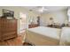 Bright bedroom with view to ensuite bathroom featuring hardwood flooring at 1703 Ryan Dr, Lutz, FL 33549