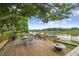 Wooden deck with seating area and lake views at 1703 Ryan Dr, Lutz, FL 33549