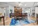 Dining room featuring a stone fireplace and hardwood floors at 1703 Ryan Dr, Lutz, FL 33549