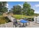 Dock with table and chairs overlooking a tranquil lake at 1703 Ryan Dr, Lutz, FL 33549