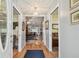 Inviting entryway with hardwood floors and views into other rooms at 1703 Ryan Dr, Lutz, FL 33549