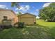 Spacious yard featuring a detached garage with an expansive lawn at 1703 Ryan Dr, Lutz, FL 33549