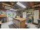 Spacious shed interior featuring a workbench, cabinets, and ample storage at 1703 Ryan Dr, Lutz, FL 33549