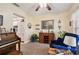 Cozy living room with a piano and comfortable seating area at 1703 Ryan Dr, Lutz, FL 33549
