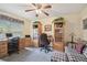 Comfortable home office space with built-in shelves and ample desk area at 1703 Ryan Dr, Lutz, FL 33549