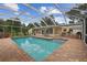 Screened-in pool and outdoor living space, ideal for relaxing or entertaining at 1703 Ryan Dr, Lutz, FL 33549