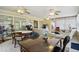 Bright sunroom with tile floors, ceiling fans, and ample space for seating, dining, and fitness at 1703 Ryan Dr, Lutz, FL 33549