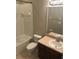 Bathroom featuring a vanity sink, commode, and tub with shower, for a functional layout at 10402 Tulip Field Way, Riverview, FL 33578