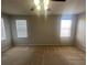 Spacious bedroom with neutral walls, carpet, ceiling fan, and bright natural light at 10402 Tulip Field Way, Riverview, FL 33578