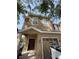 Charming two-story home with a welcoming front entrance and attached garage at 10402 Tulip Field Way, Riverview, FL 33578