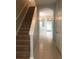 Inviting hallway with staircase leading to the second floor at 10402 Tulip Field Way, Riverview, FL 33578