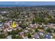 Aerial view of property showing the location, neighboring homes, and nearby businesses at 10515 Hetrick W Cir, Largo, FL 33774