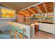 Backyard bar features a granite counter, lighting, and colorful decor for outdoor entertaining at 10515 Hetrick W Cir, Largo, FL 33774