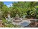 Cozy backyard fire pit area with comfortable seating, creating a relaxing outdoor space at 10515 Hetrick W Cir, Largo, FL 33774