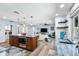 Bright, open layout connecting the living room to the kitchen with center island at 10515 Hetrick W Cir, Largo, FL 33774