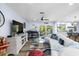 Cozy living room with modern decor, access to patio, and seamless flow to kitchen at 10515 Hetrick W Cir, Largo, FL 33774