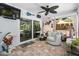 This cozy sunroom offers natural light, comfortable seating, and serene views of the outdoors at 10515 Hetrick W Cir, Largo, FL 33774