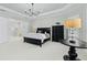 Relaxing main bedroom suite with a tray ceiling and a luxurious adjoining bathroom at 11411 Juglans Dr, Odessa, FL 33556
