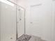 Bathroom showcases a tiled shower with a clear glass door and chrome fixtures at 11830 Brighton Knoll Loop, Riverview, FL 33579